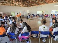 Imagem mostra jovem participando de uma oficina de justiça climática